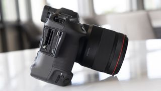 The side of the Canon EOS R3 mirrorless camera on a table
