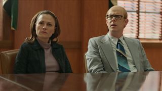 Anna Paquin as Mary Ann Broberg, Colin Hanks as Bob Broberg sitting in an office in A Friend of the Family