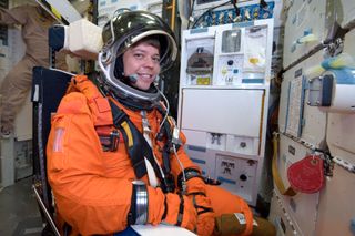 Wearing a training version of his shuttle launch and entry suit, also known as the "pumpkin suit," NASA astronaut Bob Behnken, STS-130 mission specialist, participates in a training session at NASA's Johnson Space Center ahead of the STS-130 mission, on July 21, 2009.