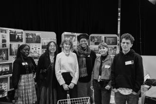 a group photo of the shortlisted photographers and mentees from Leibovitz’s mentorship program