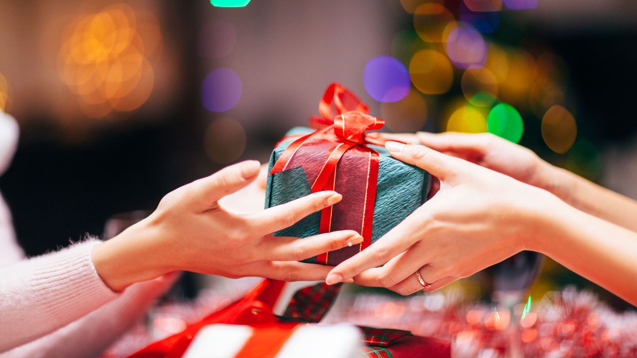 exchanging of christmas gift by getty images