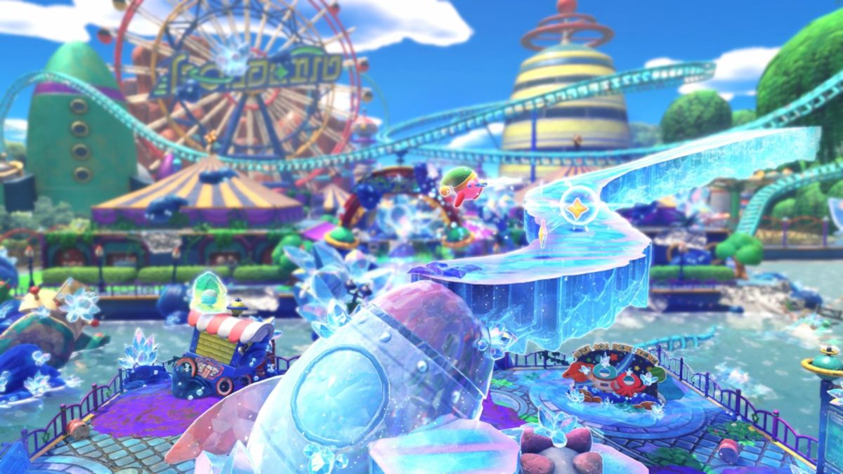 Kirby and the Forgotten Land Star-Crossed World screenshot of the amusement park stage which has been covered in crystal and a new crystal pathway has formed above the rocket statue