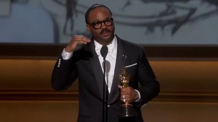 Ryan Coogler accepts the Oscar for Best Original Screenplay at the 98th Academy Awards.