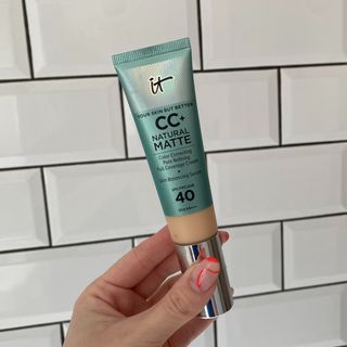 Original image showing hand holding the IT Cosmetics Natural Matte CC+ Cream