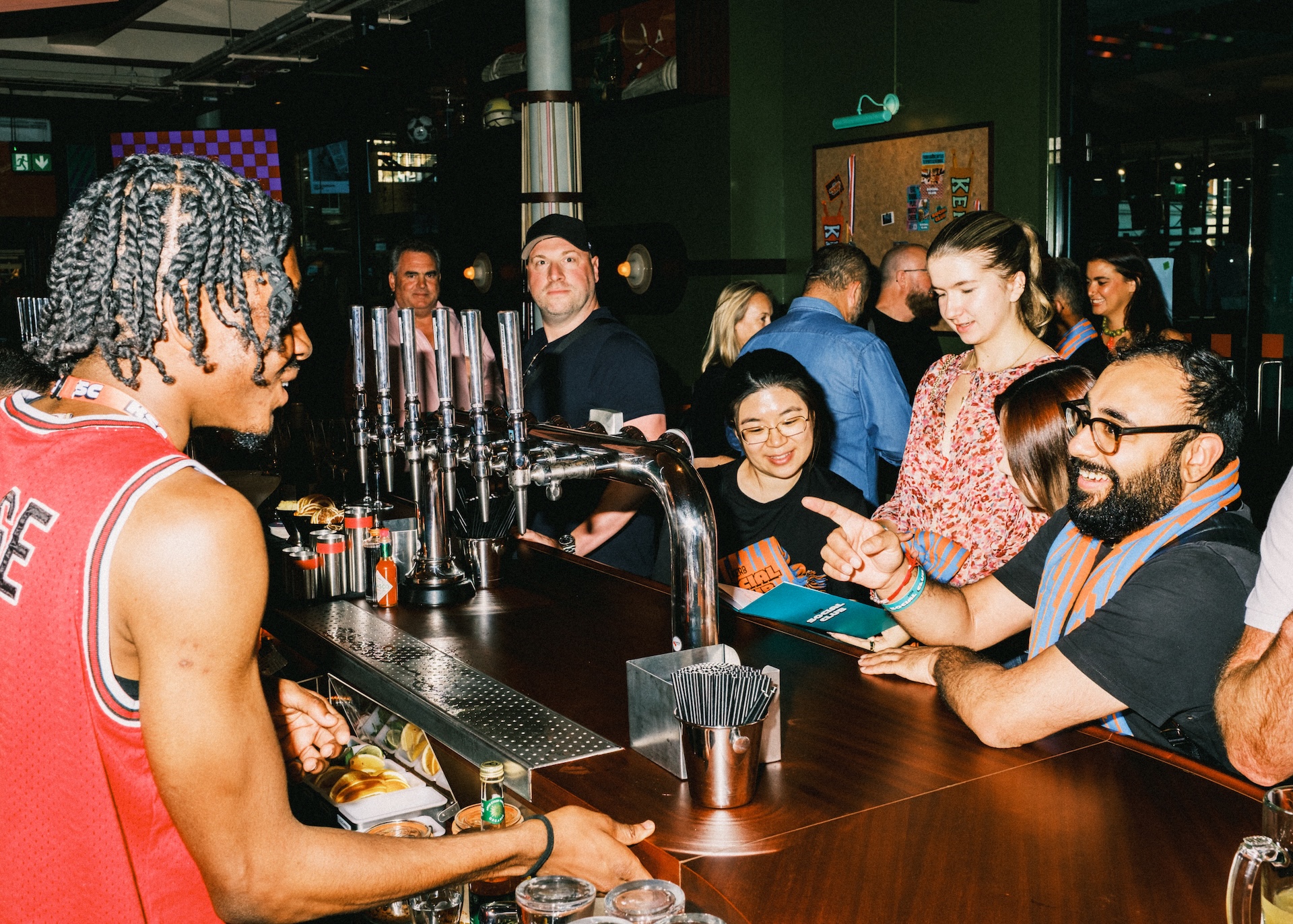 Man serving drinks in: Kerb Social Club