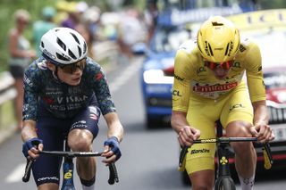 UAE Team Emirates team&#039;s Slovenian rider Tadej Pogacar wearing the overall leader&#039;s yellow jersey and Team Visma - Lease a Bike team&#039;s Danish rider Jonas Vingegaard cycle in the final kilometers of the 11th stage of the 111th edition of the Tour de France cycling race, 211 km between Ã‰vaux-les-Bains and Le Lioran, in the Massif Central mountains of central France, on July 10, 2024. (Photo by Anne-Christine POUJOULAT / AFP)