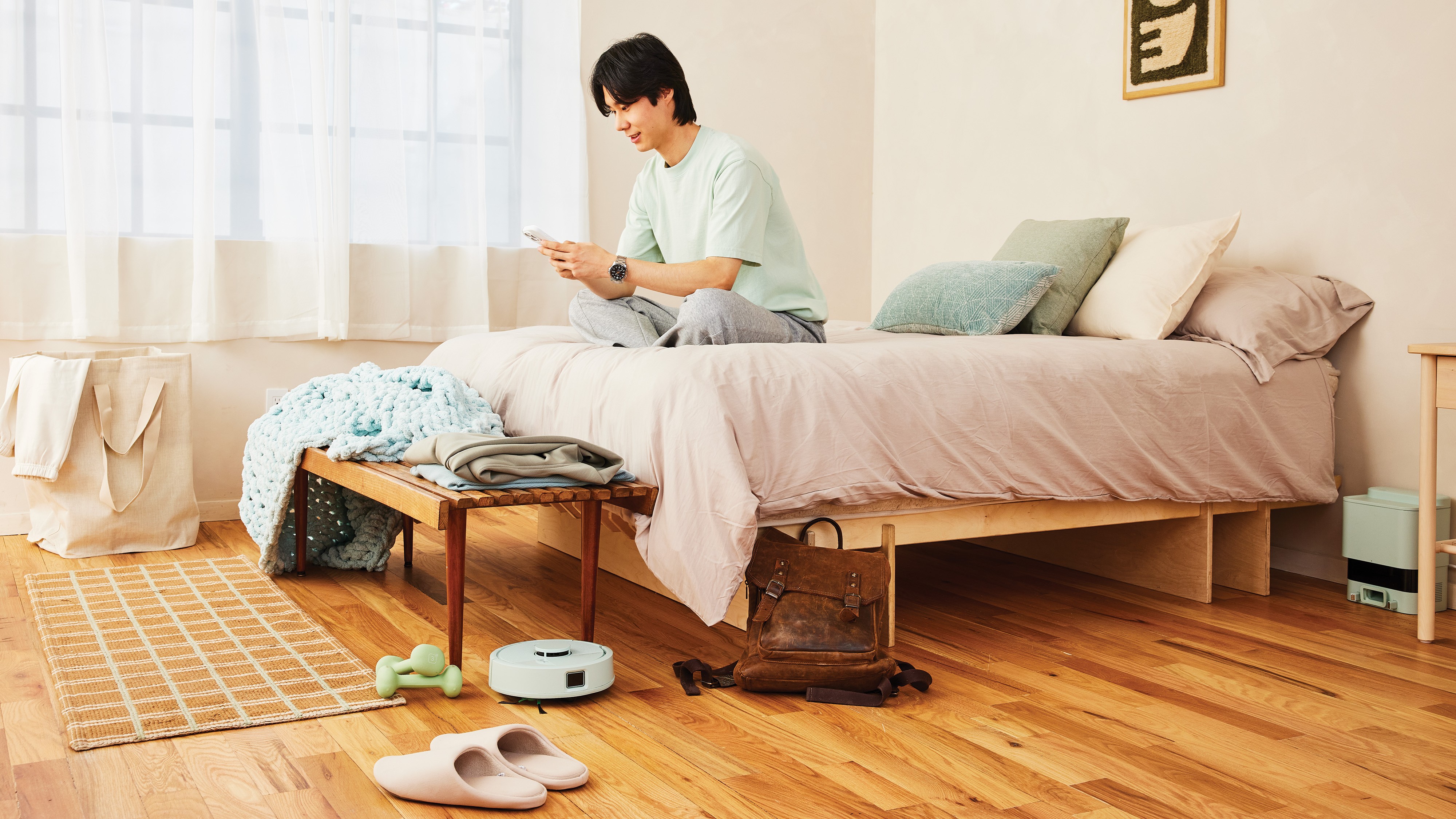 The Roomba Mini cleaning under a bed