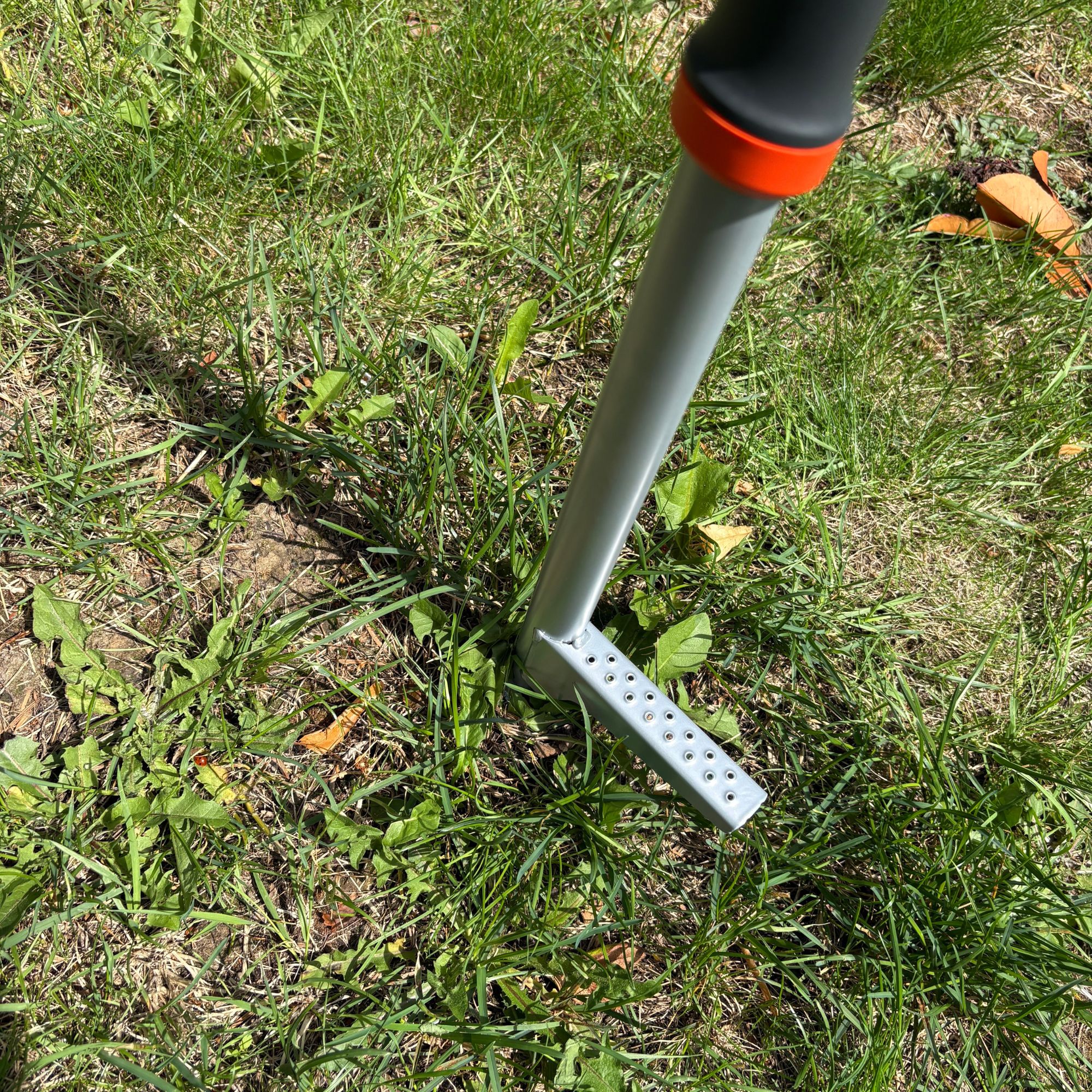 GARDENA Weed Puller removing weeds from lawn