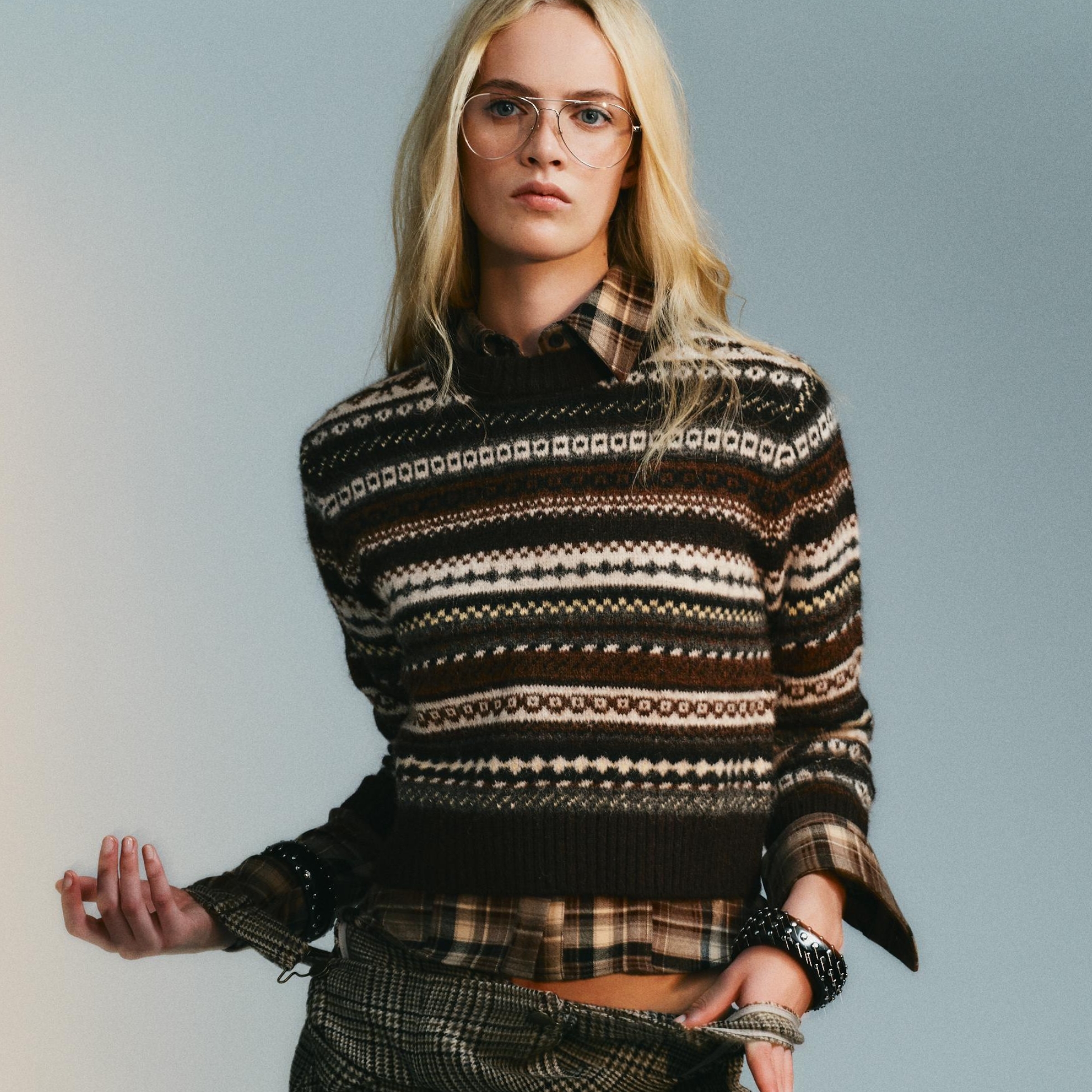 A model wearing a sweater from Zara.