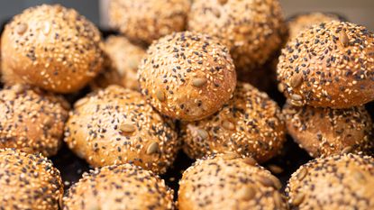 sesame seeds covering small round buns