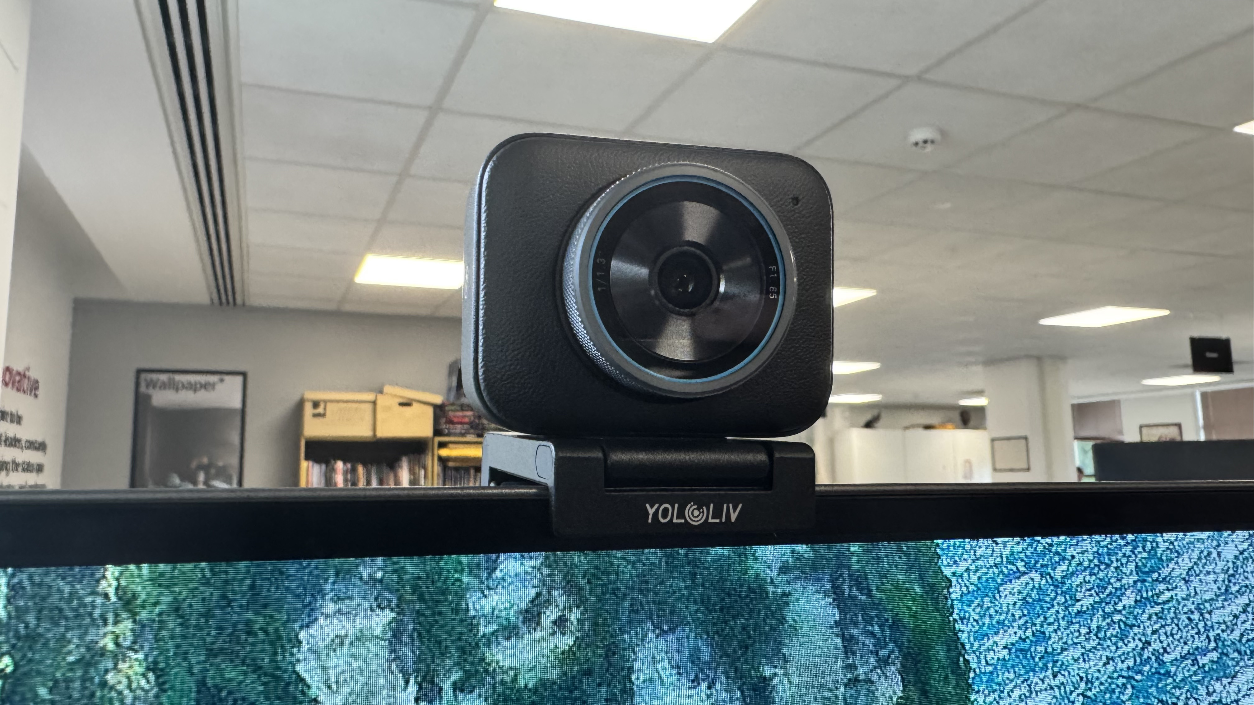 The Yololiv YoloCam S3 4K webcam on top of a monitor from the front left