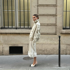 @rikkekrefting wears cream silk skirt and bomber jacket