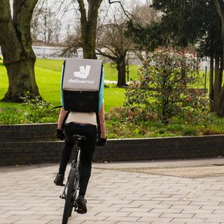 delivery man with bag and cycle