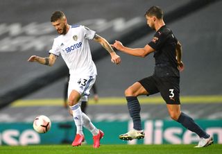 Mateusz Klich, left, relishes his lung-busting role in Leeds' midfield