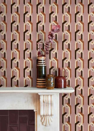 A seventies-inspired wallpaper print above a fireplace
