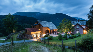 Amot Norway at dusk surrounded by mountains and trees