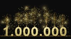 The number 1,000,000 in gold with sparklers on top of each numeral.