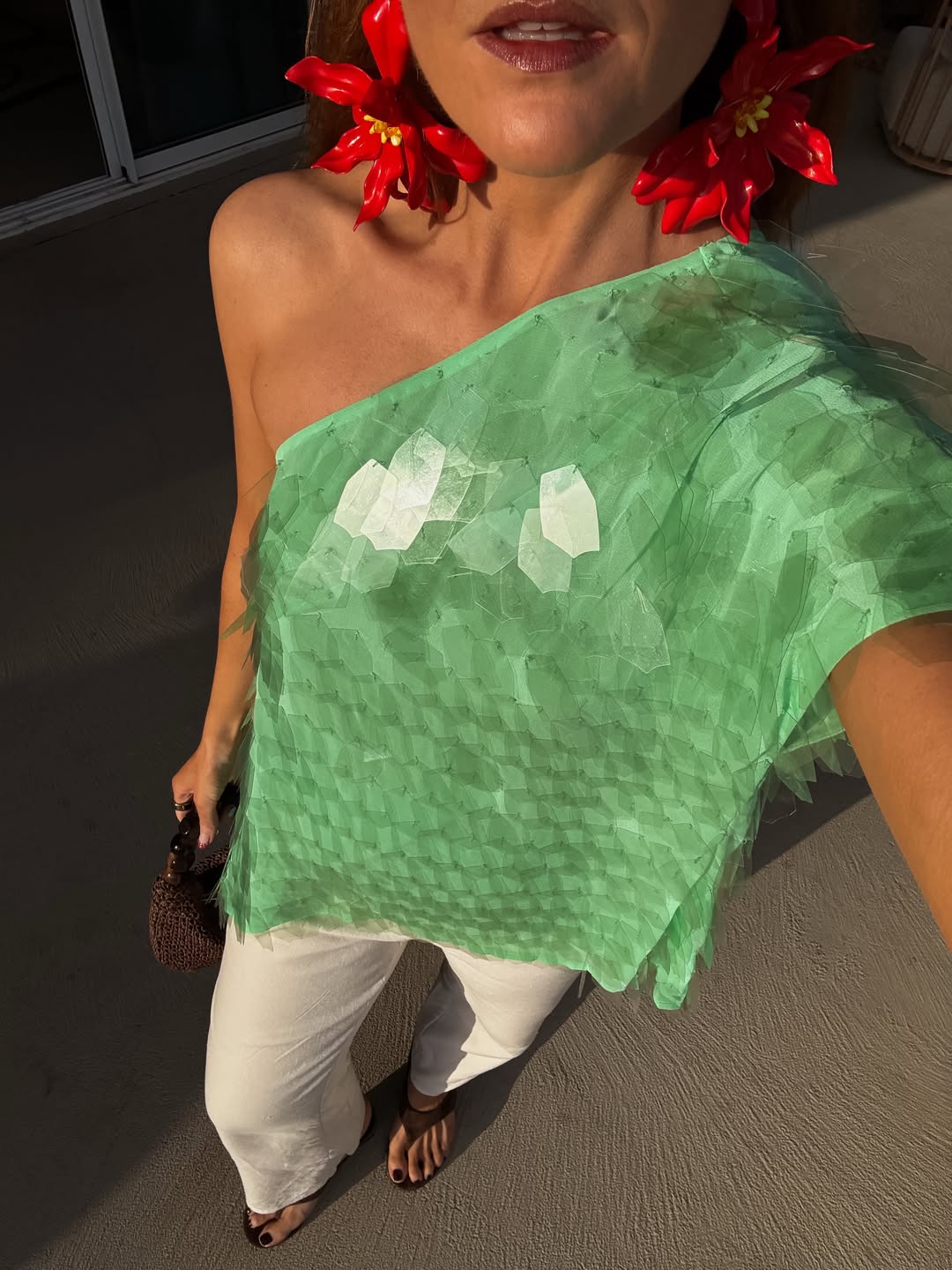 Influencer Rebecca Ferraz Wyatt wearing an apple green sequin top.