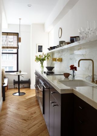 A kitchen with floating shelves