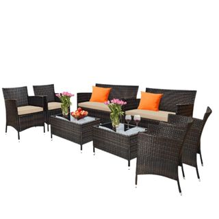 An eight piece brown and white rattan furniture set