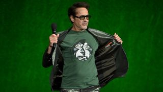 Robert Downey Jr holding his jacket open to show a t-shirt with Doctor Doom on it during Disney's CinemaCon 2026 presentation