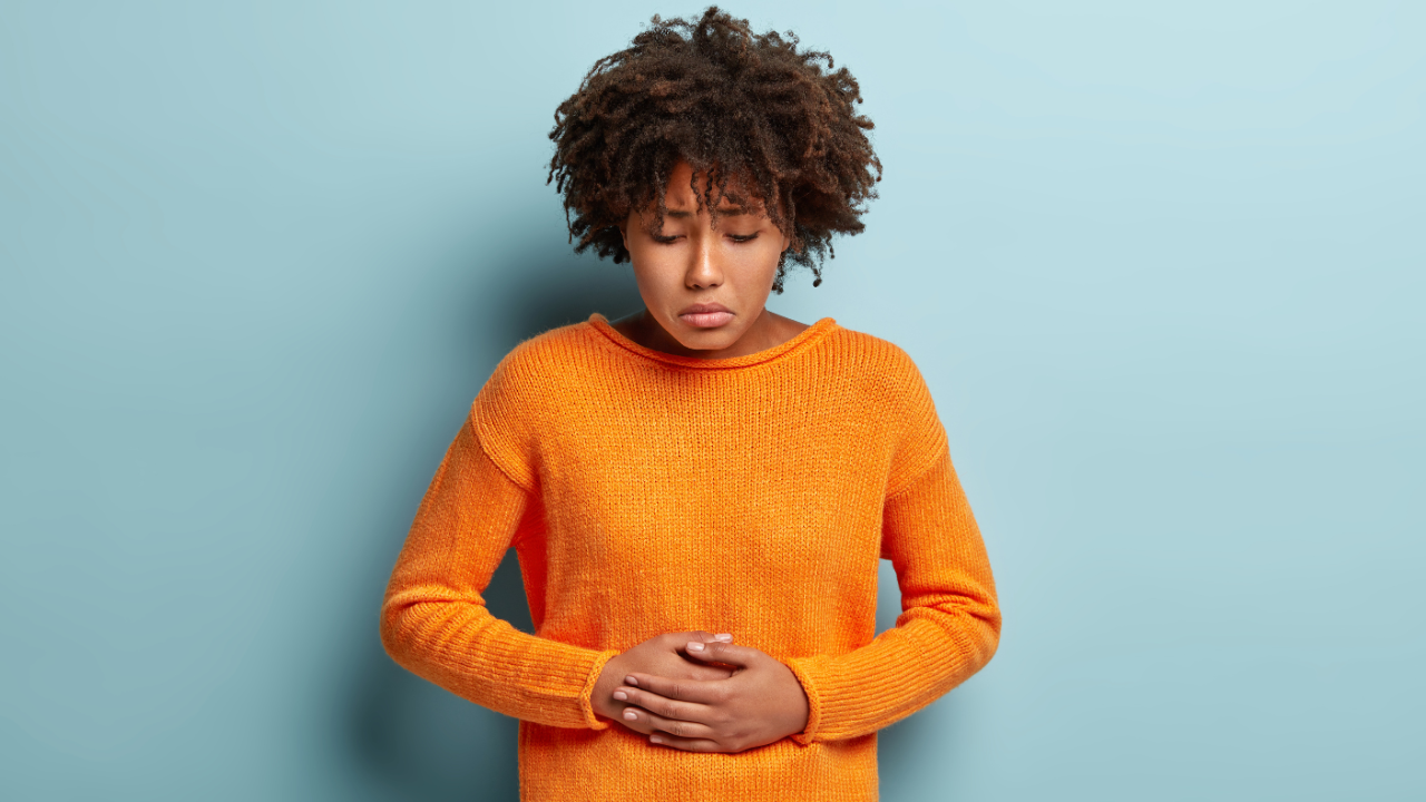 woman holding stomach