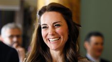 Catherine, Duchess of Cambridge laughs as she speaks with guests during a reception in support of The Anna Freud Centre on May 4, 2016 at Spencer House in London, England