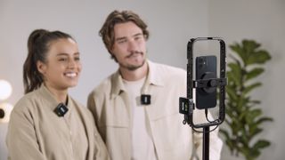 Røde Wireless Go (Gen 3) microphone kit being used to film two presenters on an iPhone