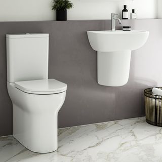 rimless toilet and wall-hung sink in modern bathroom