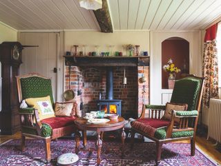 traditional living room with inglenook fireplace and tongue and groove ceiling panelling