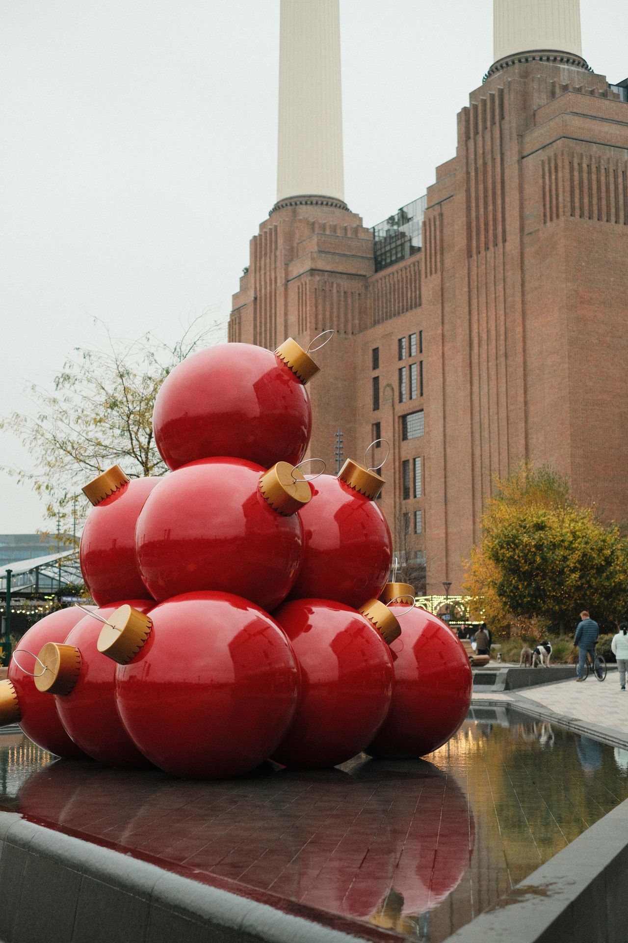 Large sculpture of stacked baubles outside London's Battersea Power Station