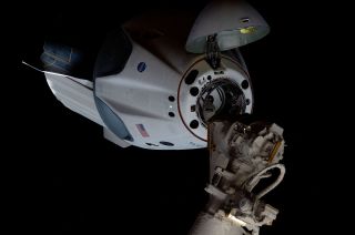 SpaceX's Crew Dragon "Endeavour" approaches a docking with the International Space Station with NASA astronauts Doug Hurley and Bob Behnken aboard, Sunday, May 31, 2020.