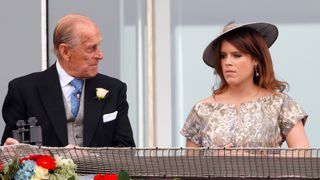 Prince Philip, Duke of Edinburgh and Princess Eugenie of York watch the racing as they attend Derby Day