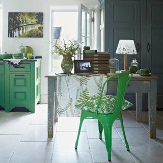 kitchen with green worktop and cupboard