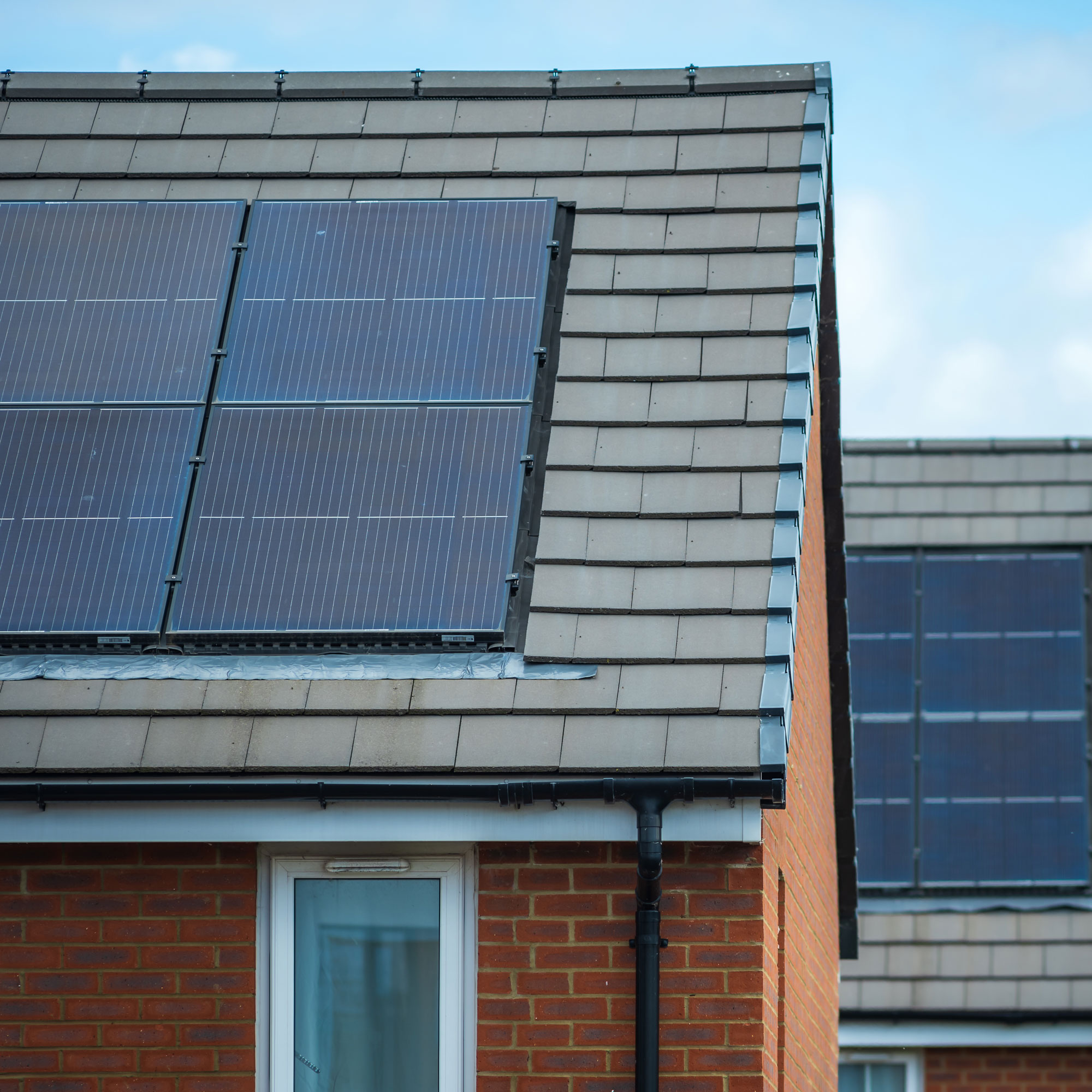 Solar panel on a grey sloping roof