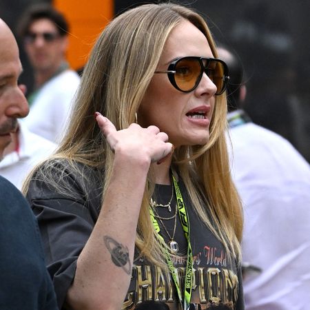 Adele arrived at the Formula 1 British Grand Prix in the graphic tee trend and flip-flops