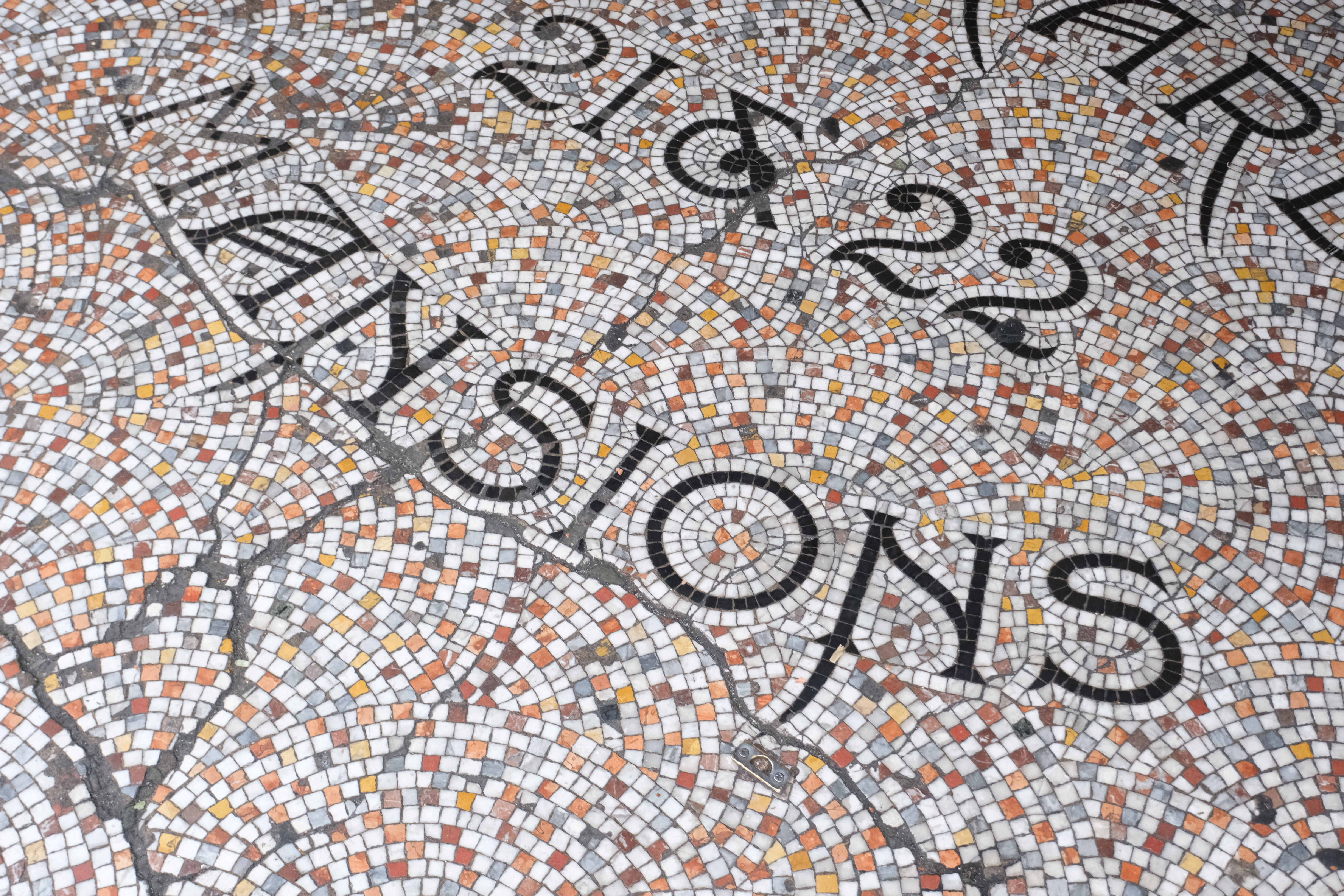 Colourful tiled music floor reading 21 and 22 mansions