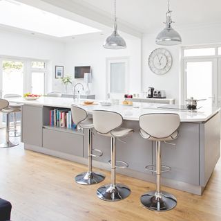 White kitchen with grey kitchen island