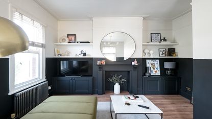 living room with black fireplace and built in storage