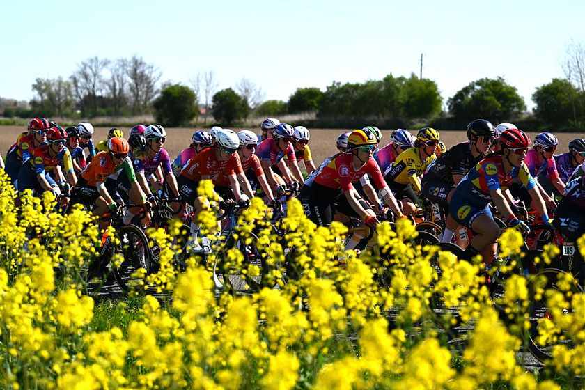 DENAIN, FRANCE - APRIL 12: (L-R) Sofia Bertizzolo of Italy and Team UAE Team ADQ, Marte Berg Edseth of Norway and Team Uno-X Mobility and Lauretta Hanson of Australia and Team Lidl-Trek compete passing through flowery landscape during the 5th Paris-Roubaix Femmes 2025 a 148.5km one day race from Denain to Roubaix / #UCIWT / on April 12, 2025 in Roubaix, France. (Photo by Luc Claessen/Getty Images)