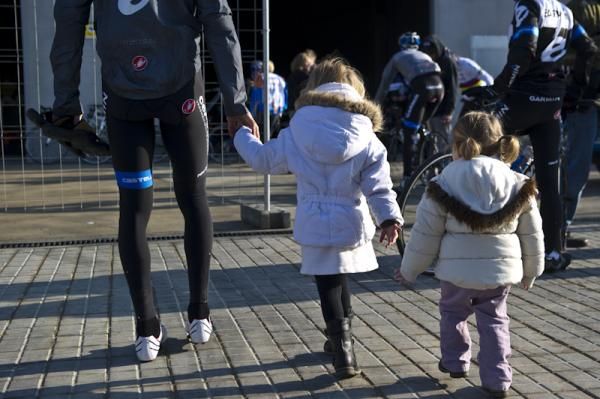 Vande Velde arrives for training with two of his biggest fans