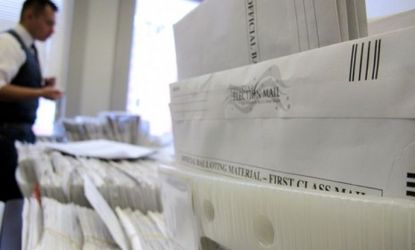 Milwaukee Election Commission staffer Marcelo Guardiola sorts absentee ballots on Nov. 5 in Wisconsin. 