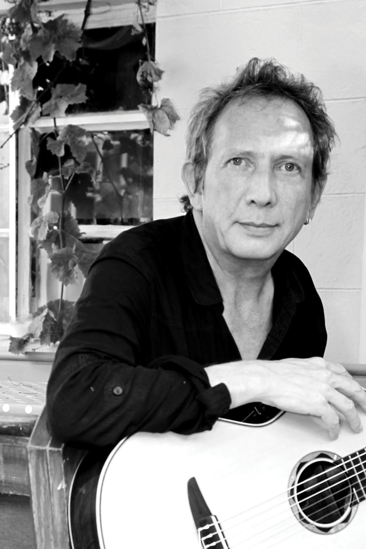 Dave Burrluck with an nylon-string guitar