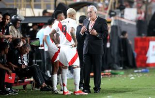 Head coach Jorge Fossati of Peru talks to Paolo Guerrero and Wilder Cartagena during the friendly match between Peru and Dominican Republic at Estadio Monumental on March 26, 2024 in Lima, Peru. (Photo by Raul Sifuentes/Getty Images)