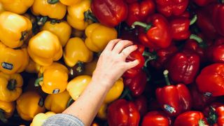 Grabbing peppers for a vegan diet