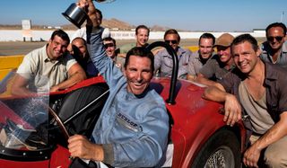 Ford v Ferrari Christian Bale hoisting his trophy up in the air