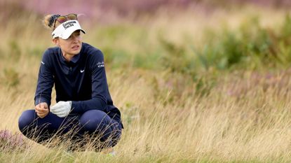 Nelly Korda sitting in the rough