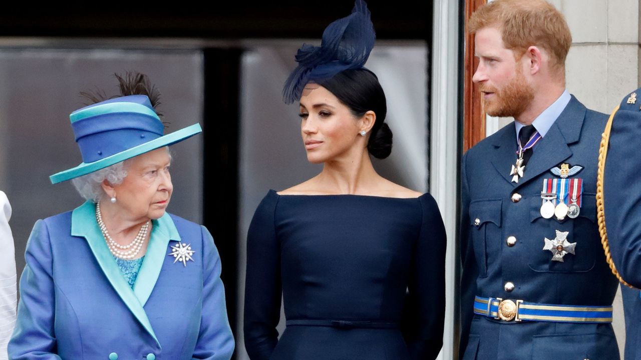 Queen Elizabeth II, Meghan Markle and Prince Harry on the balcony of Buckingham Palace in 2018