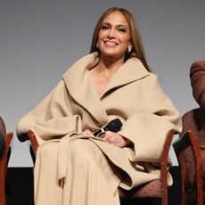 Jennifer Lopez wearing a camel coat