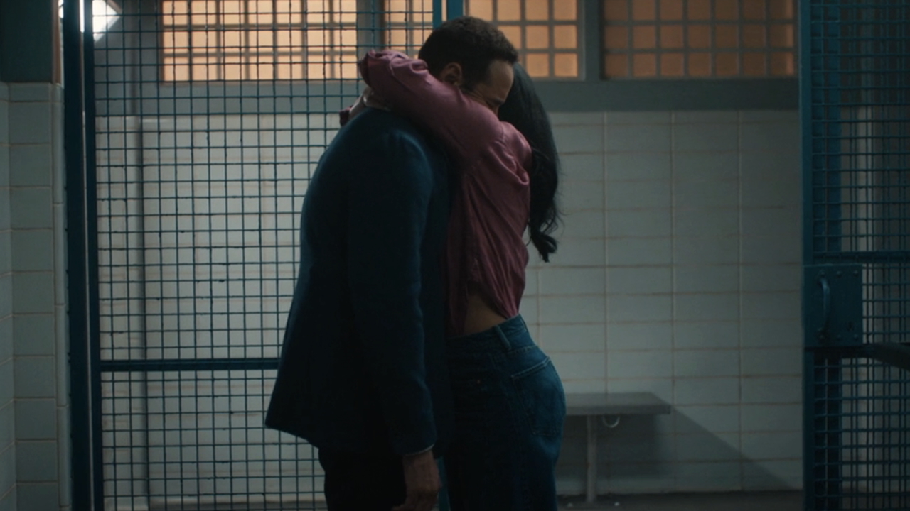 Lucia hugging Karadec goodbye in jail as he leaves his arms hanging by his sides in High Potential Season 2 finale